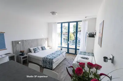 Un ou plusieurs lits dans un hébergement de l'établissement Hotel Mercedes
