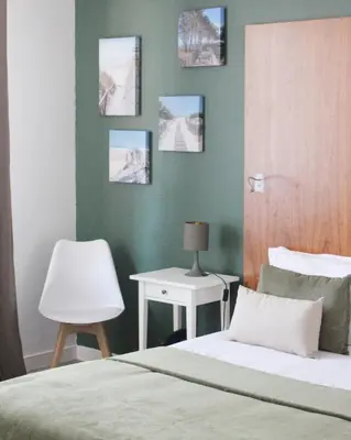 Un ou plusieurs lits dans un hébergement de l'établissement Hotel Au Bon Coin du Lac