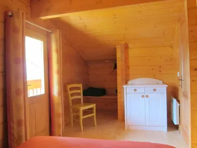 Un ou plusieurs lits dans un hébergement de l'établissement Chalet Elocances