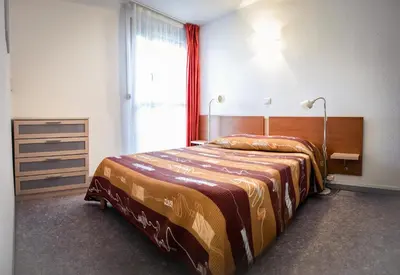 Un ou plusieurs lits dans un hébergement de l'établissement Les Pavillons du Rooy
