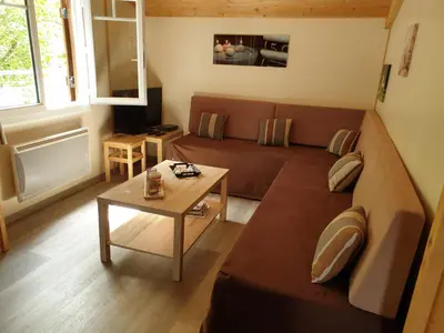 Coin salon dans l'établissement Pyla Chalet et mobilhom 6 personnes Magda