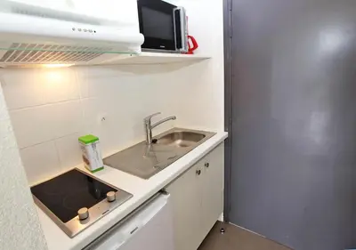 Cuisine ou kitchenette dans l'établissement Plage Centrale