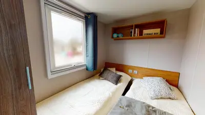 Un ou plusieurs lits dans un hébergement de l'établissement Camping Officiel Siblu La Réserve