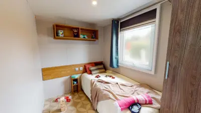 Un ou plusieurs lits dans un hébergement de l'établissement Camping Officiel Siblu La Réserve