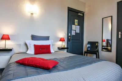 Un ou plusieurs lits dans un hébergement de l'établissement Hôtel Auberge l'Estanquet