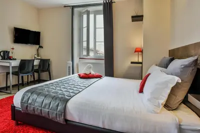 Un ou plusieurs lits dans un hébergement de l'établissement Hôtel Auberge l'Estanquet