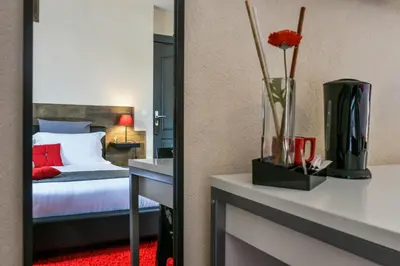Un ou plusieurs lits dans un hébergement de l'établissement Hôtel Auberge l'Estanquet