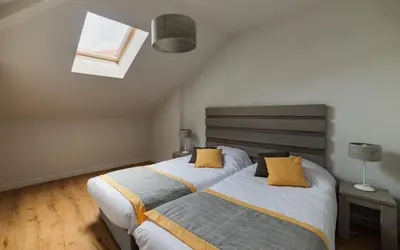 Un ou plusieurs lits dans un hébergement de l'établissement Lagrange Vacances Les Balcons de l'Océan