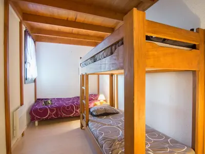 Un ou plusieurs lits dans un hébergement de l'établissement Apartment Douc-7 by Interhome