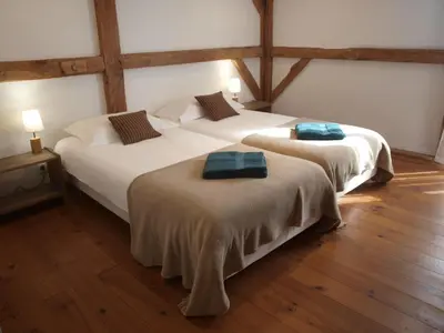 Un ou plusieurs lits dans un hébergement de l'établissement Grand gîte Gastes