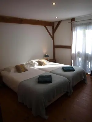 Un ou plusieurs lits dans un hébergement de l'établissement Grand gîte Gastes