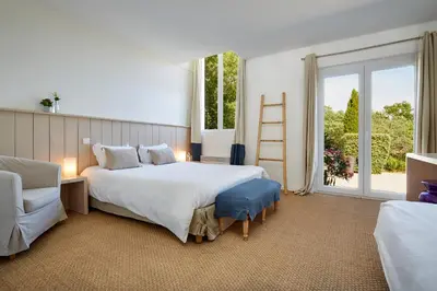 Un ou plusieurs lits dans un hébergement de l'établissement Hotel La Maison de la Prade