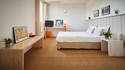 Un ou plusieurs lits dans un hébergement de l'établissement Hotel La Maison de la Prade