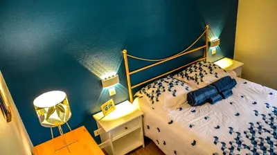 Un ou plusieurs lits dans un hébergement de l'établissement Cottage 40 **** Beach Golf Surf à pieds