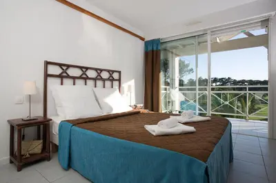 Un ou plusieurs lits dans un hébergement de l'établissement Madame Vacances Residence Du Golf
