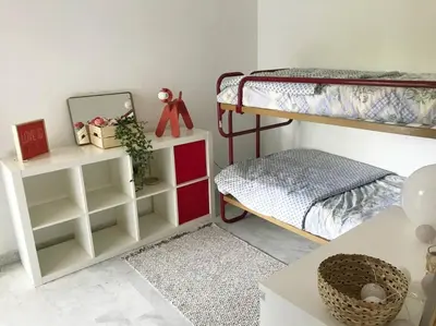 Un ou plusieurs lits dans un hébergement de l'établissement Appartement calme et familial au Centre d'Hossegor