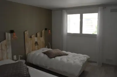 Un ou plusieurs lits dans un hébergement de l'établissement VILLA FLEUR DES PINS - 2 CHAMBRES - 3 étoiles BANC D ARGUIN