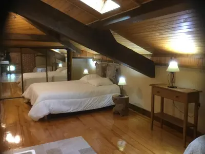 Un ou plusieurs lits dans un hébergement de l'établissement gîte porte de la bastide