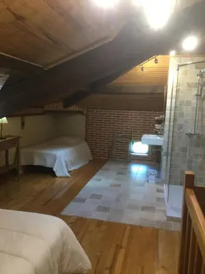 Un ou plusieurs lits dans un hébergement de l'établissement gîte porte de la bastide