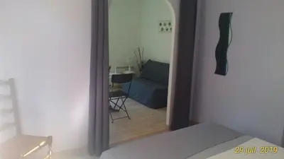 Coin salon dans l'établissement Le Clos des Palombes WIFI CLIMATISATION