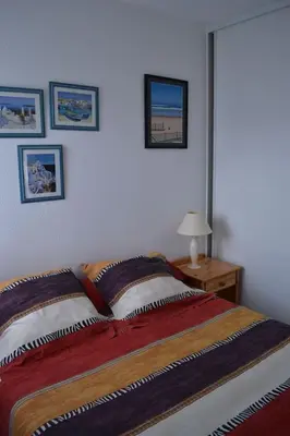 Un ou plusieurs lits dans un hébergement de l'établissement Appartement à 50m de la plage