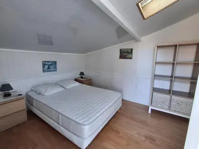 Un ou plusieurs lits dans un hébergement de l'établissement Villa patio à 200 m de la plage à Capbreton