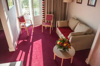 Coin salon dans l'établissement Hôtel du Parc