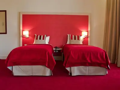 Un ou plusieurs lits dans un hébergement de l'établissement Hôtel du Parc