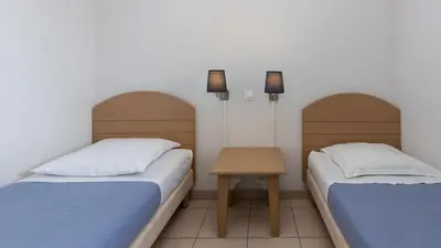 Un ou plusieurs lits dans un hébergement de l'établissement Vacancéole - L'Allée des Dunes - Ondres Plage