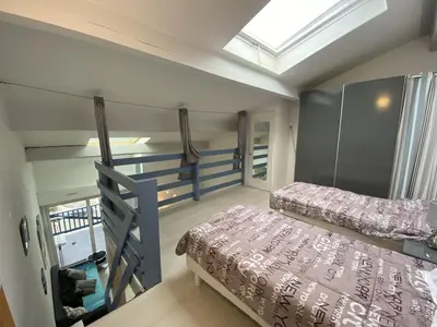 Un ou plusieurs lits dans un hébergement de l'établissement Appartement avec terrasse, parking et vue sur port à Capbreton - FR-1-413-130
