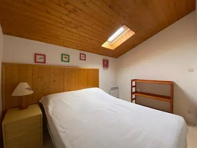 Un ou plusieurs lits dans un hébergement de l'établissement Maison calme avec piscine, 3 chambres, Capbreton - FR-1-413-114