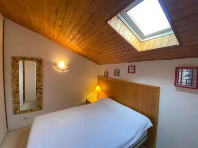 Un ou plusieurs lits dans un hébergement de l'établissement Maison calme avec piscine, 3 chambres, Capbreton - FR-1-413-114