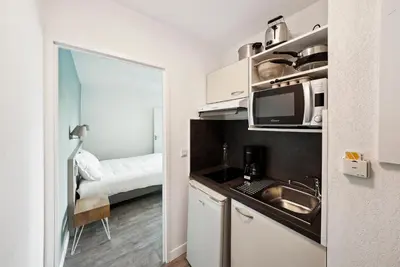 Cuisine ou kitchenette dans l'établissement All Suites Appart Hôtel - Bassin d'Arcachon - Dune du Pilat
