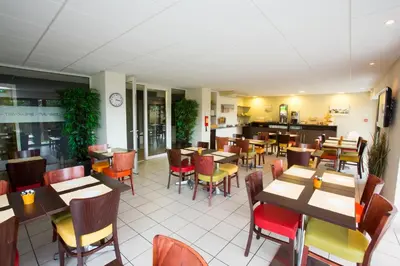 Restaurant ou autre lieu de restauration dans l'établissement All Suites Appart Hôtel - Bassin d'Arcachon - Dune du Pilat