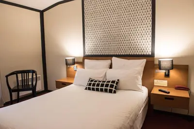 Un ou plusieurs lits dans un hébergement de l'établissement Hotel de Jouvence