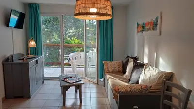Coin salon dans l'établissement T2 Turquoise Ondres plage avec piscine et tennis