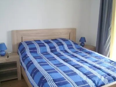 Un ou plusieurs lits dans un hébergement de l'établissement Appartement T3 avec piscine, sauna en front de mer à Biscarrosse Plage - FR-1-521-1