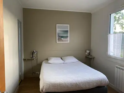 Un ou plusieurs lits dans un hébergement de l'établissement Logis Hôtel Le Clos Pité