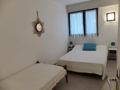 Un ou plusieurs lits dans un hébergement de l'établissement Appartement Pour 5 Personnes - Residence Tursan