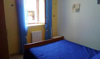 Un ou plusieurs lits dans un hébergement de l'établissement Appartement a la campagne