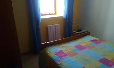 Un ou plusieurs lits dans un hébergement de l'établissement Appartement a la campagne