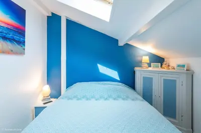 Un ou plusieurs lits dans un hébergement de l'établissement Les Cottages - Maison 4 à 5 personnes au bord de l'océan