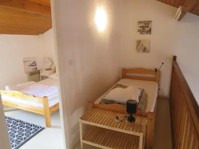 Un ou plusieurs lits dans un hébergement de l'établissement Maison mitoyenne proche de la plage