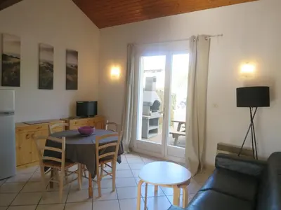 Télévision ou salle de divertissement dans l'établissement Maison mitoyenne proche de la plage