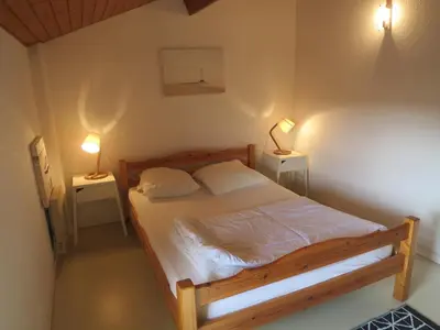 Un ou plusieurs lits dans un hébergement de l'établissement Maison mitoyenne proche de la plage