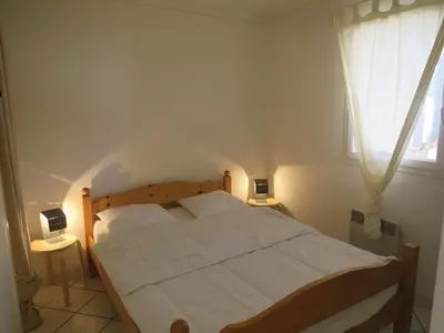 Un ou plusieurs lits dans un hébergement de l'établissement Appartement récent proche de la plage