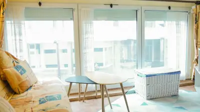 Coin salon dans l'établissement Appartement Cosy sur Port de Plaisance