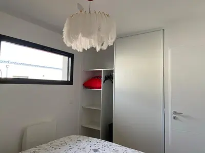 Un ou plusieurs lits dans un hébergement de l'établissement Villa L'espourguit proche de l'océan et de la forêt