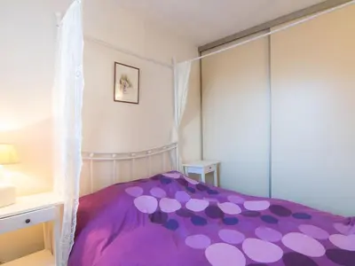 Un ou plusieurs lits dans un hébergement de l'établissement Apartment Le Grand Pavois by Interhome