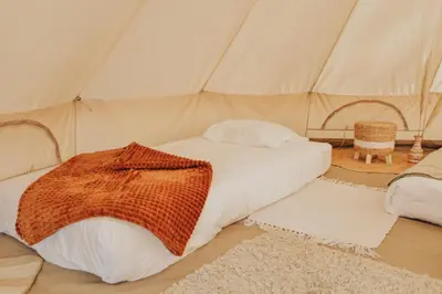 Un ou plusieurs lits dans un hébergement de l'établissement Cocooning Tipi - Seignosse